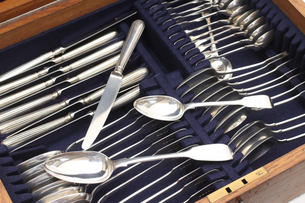 A TABLE SERVICE FOR TWELVE PLACE SETTINGS Image