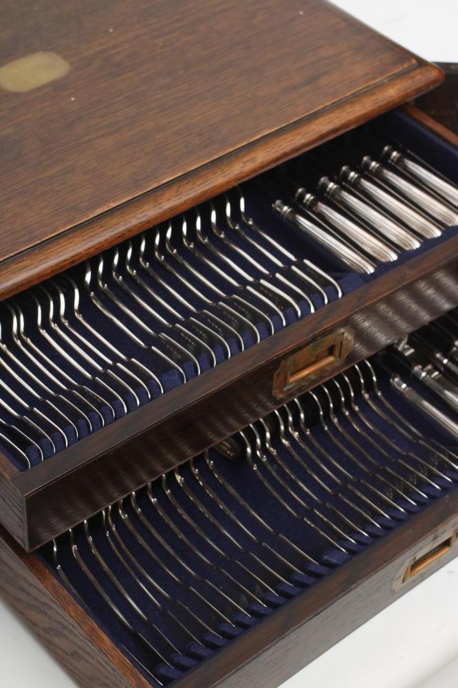 A TABLE SERVICE FOR TWELVE PLACE SETTINGS Image