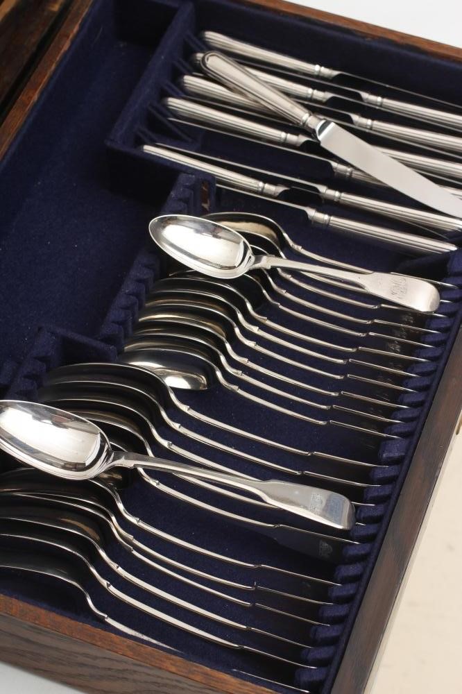 A TABLE SERVICE FOR TWELVE PLACE SETTINGS Image