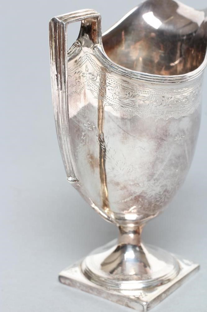 A LATE GEORGE III HELMET JUG Image