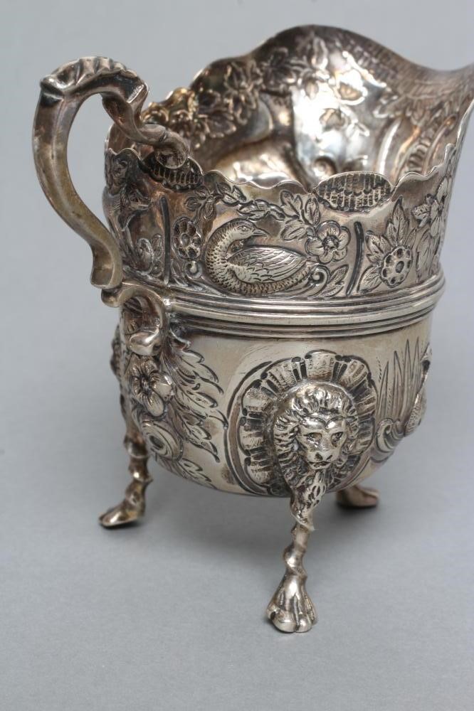 A LATE VICTORIAN CREAM JUG AND SUGAR BASIN Image