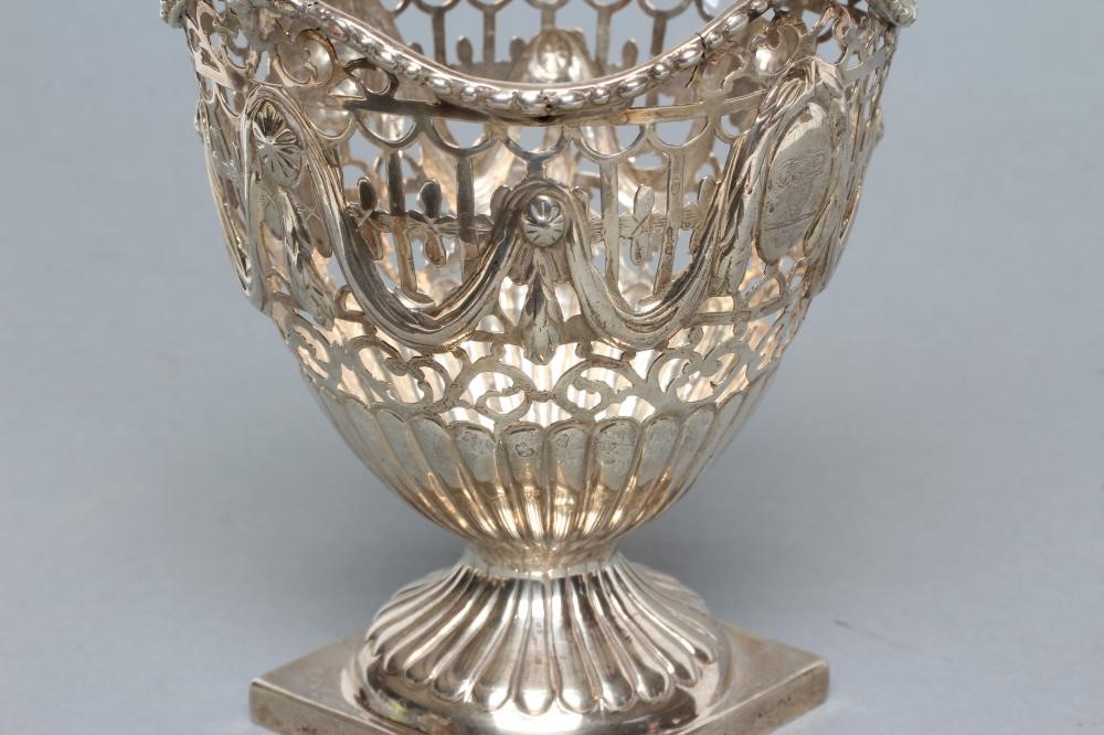 A GEORGE III SUGAR BASKET Image