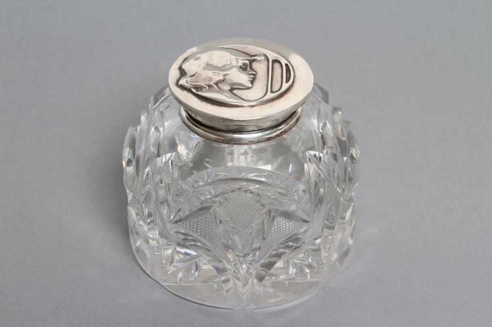 A LATE VICTORIAN CLEAR GLASS INKWELL Image