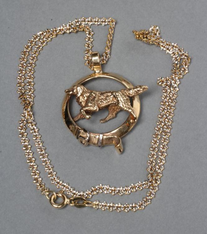 A 9CT GOLD PENDANT modelled as a buckled collar and centred by a dog Image