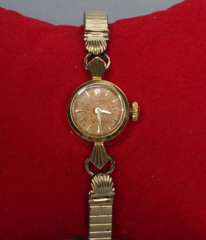 A LADY'S 18K GOLD ROLEX ORCHID WRISTWATCH Image