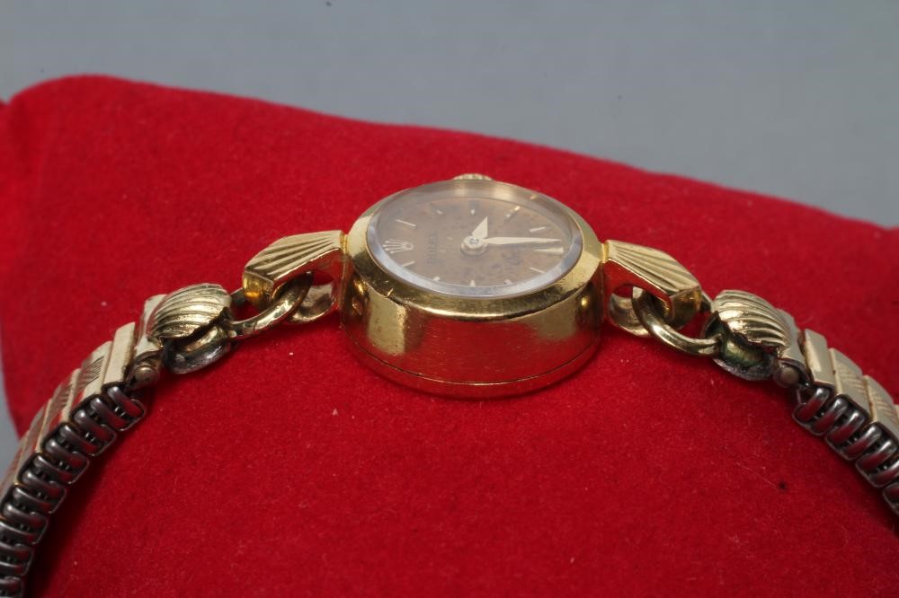 A LADY'S 18K GOLD ROLEX ORCHID WRISTWATCH Image