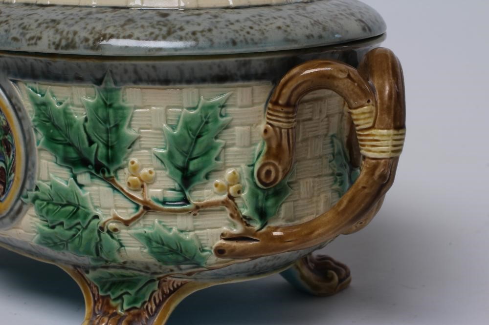A VICTORIAN MINTON MAJOLICA GAME PIE DISH AND COVER of oval basket weave form with naturalistic Image