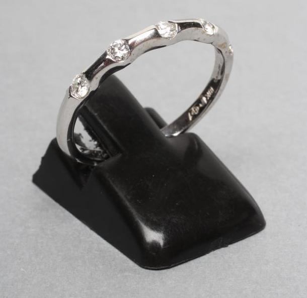 A DIAMOND HALF HOOP ETERNITY RING Image