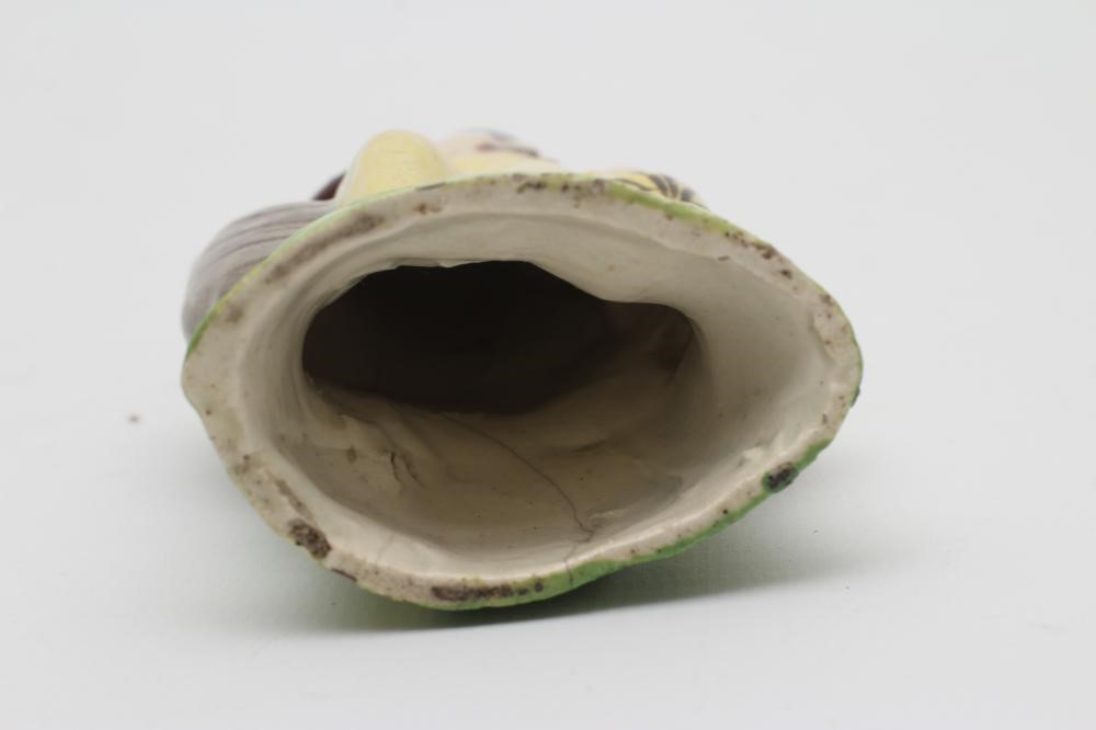 A CREAMWARE TOY FIGURE OF A SAILOR Image