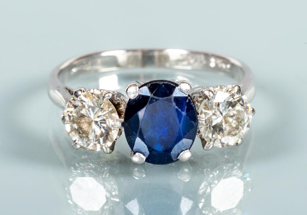 A SAPPHIRE AND DIAMOND THREE STONE RING Image