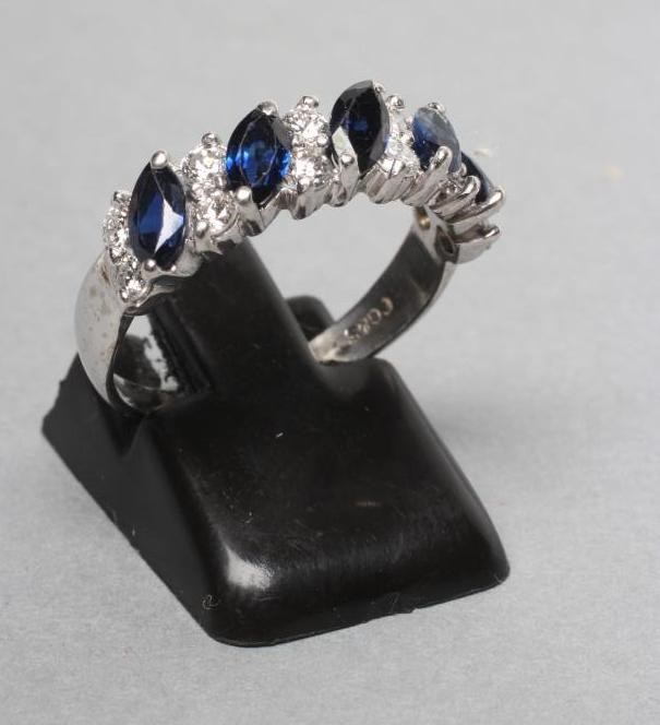 A SAPPHIRE AND DIAMOND HALF HOOP ETERNITY RING Image