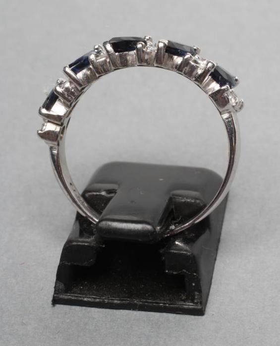 A SAPPHIRE AND DIAMOND HALF HOOP ETERNITY RING Image