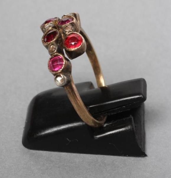 A VICTORIAN RUBY AND DIAMOND CROSSOVER RING collet set with six rubies and five rose cut diamonds to Image