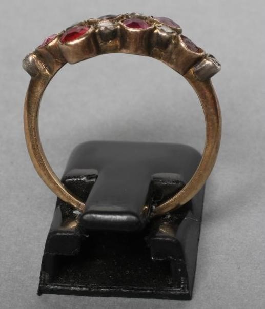 A VICTORIAN RUBY AND DIAMOND CROSSOVER RING collet set with six rubies and five rose cut diamonds to Image