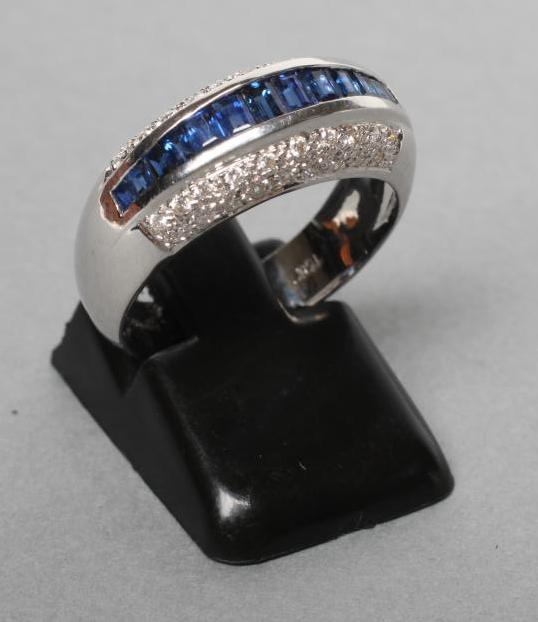 A SAPPHIRE AND DIAMOND BAND RING Image