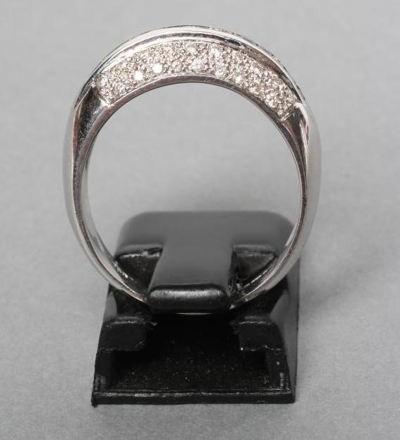 A SAPPHIRE AND DIAMOND BAND RING Image