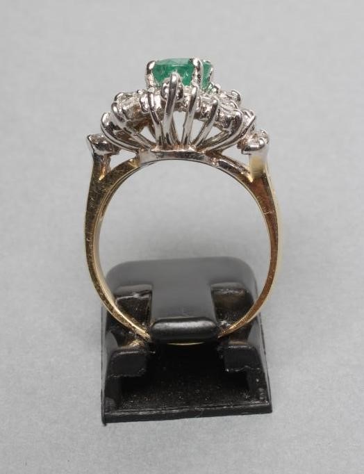 AN EMERALD AND DIAMOND CLUSTER RING Image