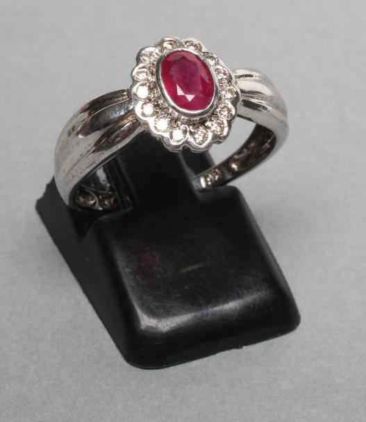A RUBY AND DIAMOND CLUSTER RING Image