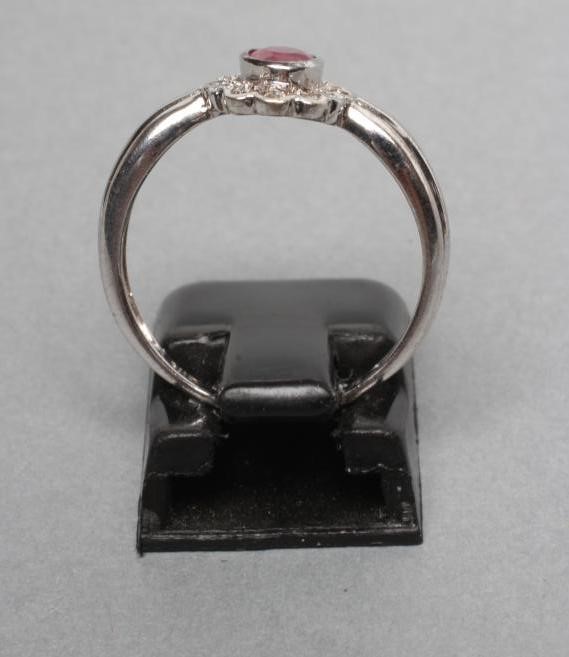 A RUBY AND DIAMOND CLUSTER RING Image