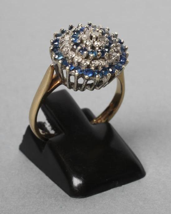 A SAPPHIRE AND DIAMOND BOSS RING Image
