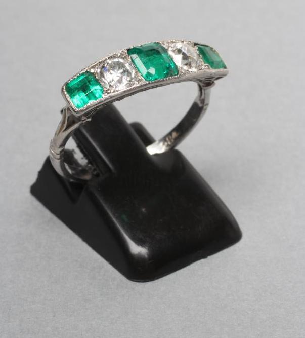 A FIVE STONE EMERALD AND DIAMOND RING Image