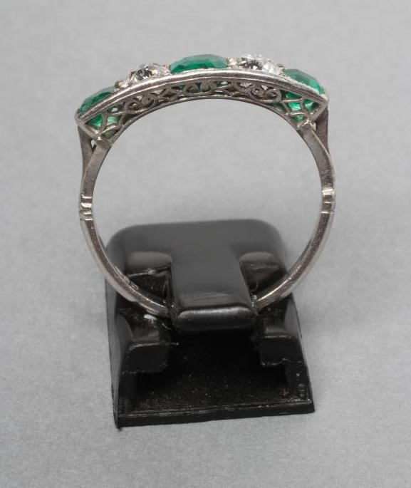 A FIVE STONE EMERALD AND DIAMOND RING Image
