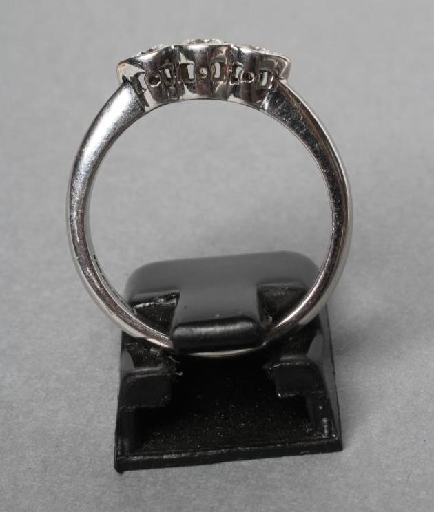 A THREE STONE DIAMOND RING Image