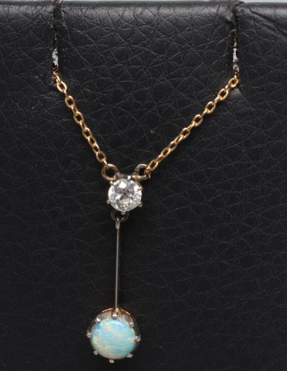 A DIAMOND AND OPAL PENDANT Image