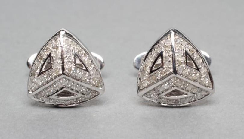 A PAIR OF DIAMOND CUFFLINKS Image
