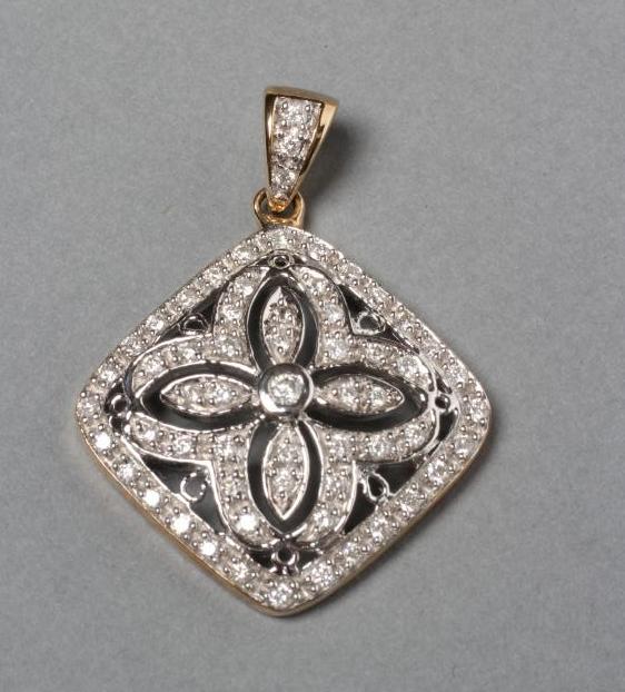 A DIAMOND PENDANT of quatrefoil form Image