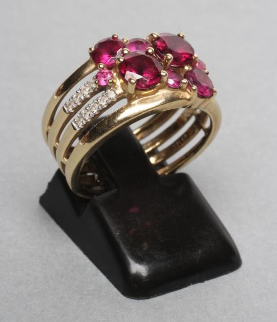 AN ALMANDINE GARNET AND DIAMOND BAND RING Image
