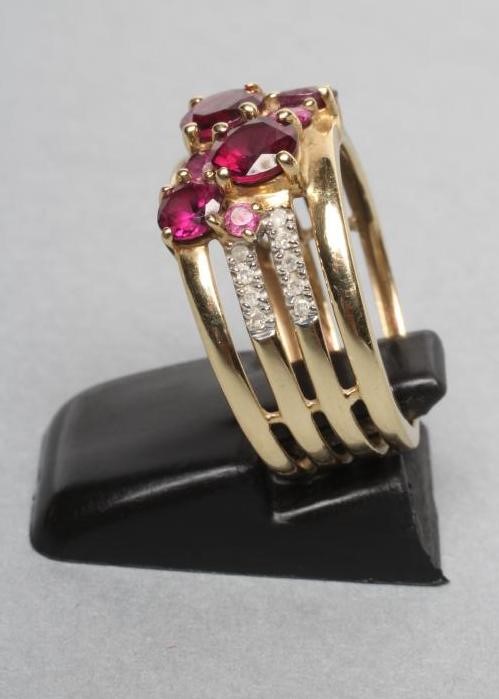 AN ALMANDINE GARNET AND DIAMOND BAND RING Image