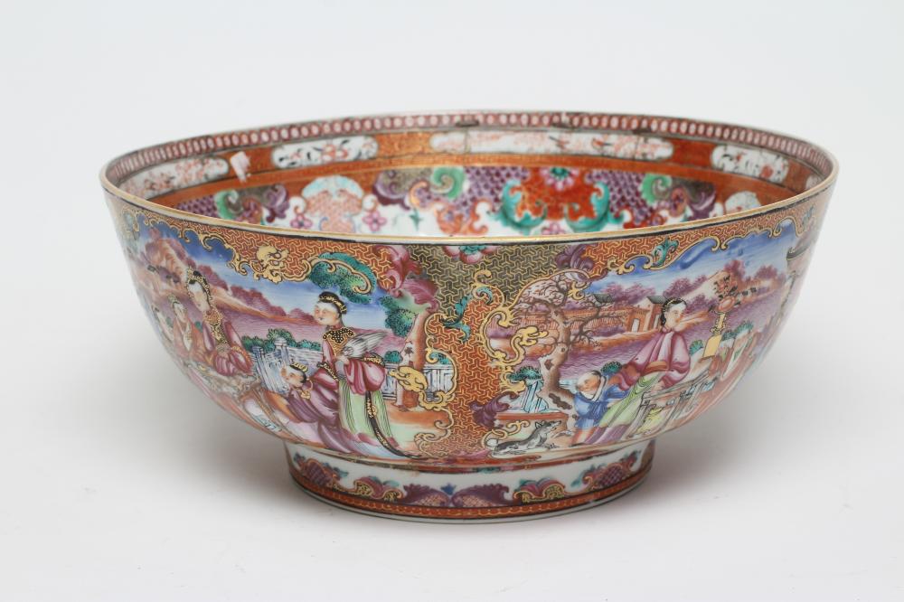 A CHINESE EXPORT PORCELAIN PUNCH BOWL painted in famille rose enamels with panels of figures Image