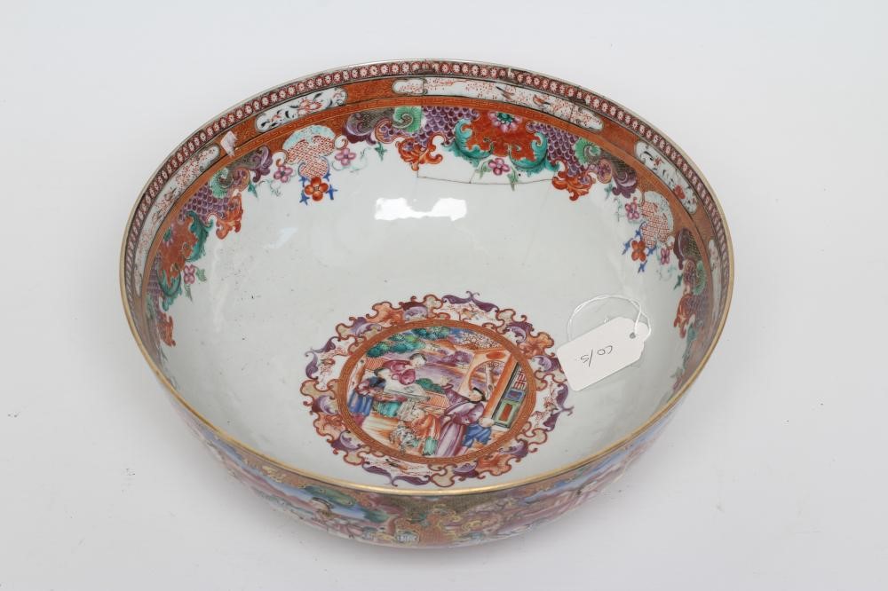 A CHINESE EXPORT PORCELAIN PUNCH BOWL painted in famille rose enamels with panels of figures Image