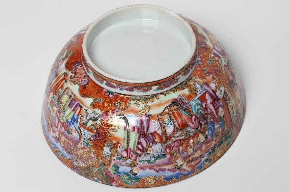 A CHINESE EXPORT PORCELAIN PUNCH BOWL painted in famille rose enamels with panels of figures Image