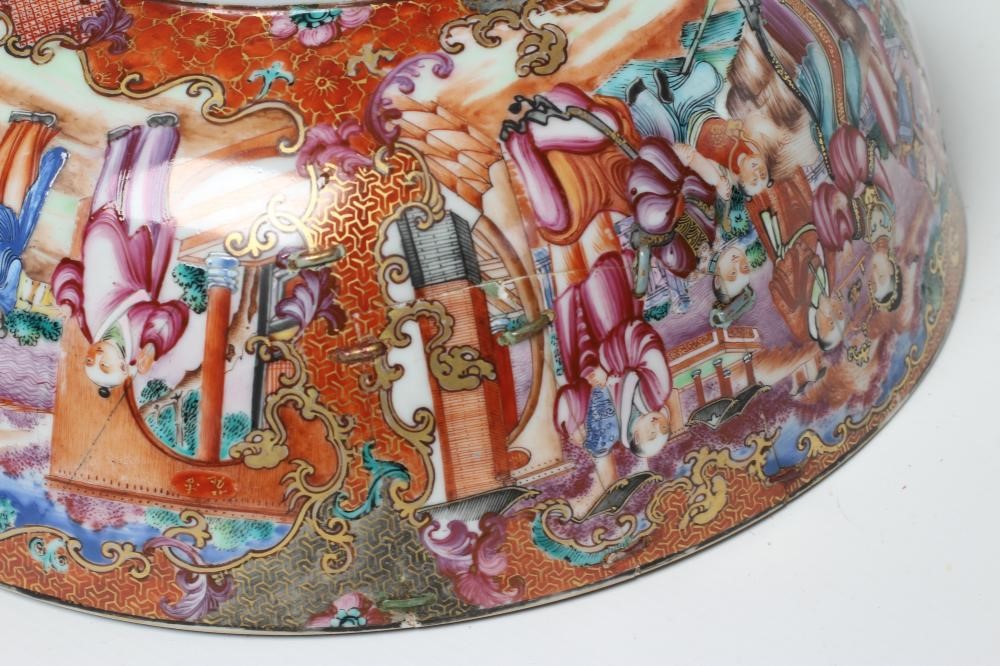 A CHINESE EXPORT PORCELAIN PUNCH BOWL painted in famille rose enamels with panels of figures Image