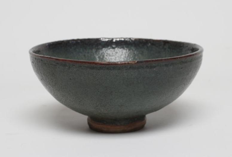 A CHINESE STONEWARE BOWL of plain circular form in a green "Jun" glaze Image