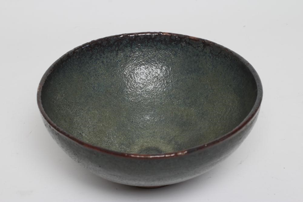 A CHINESE STONEWARE BOWL of plain circular form in a green "Jun" glaze Image