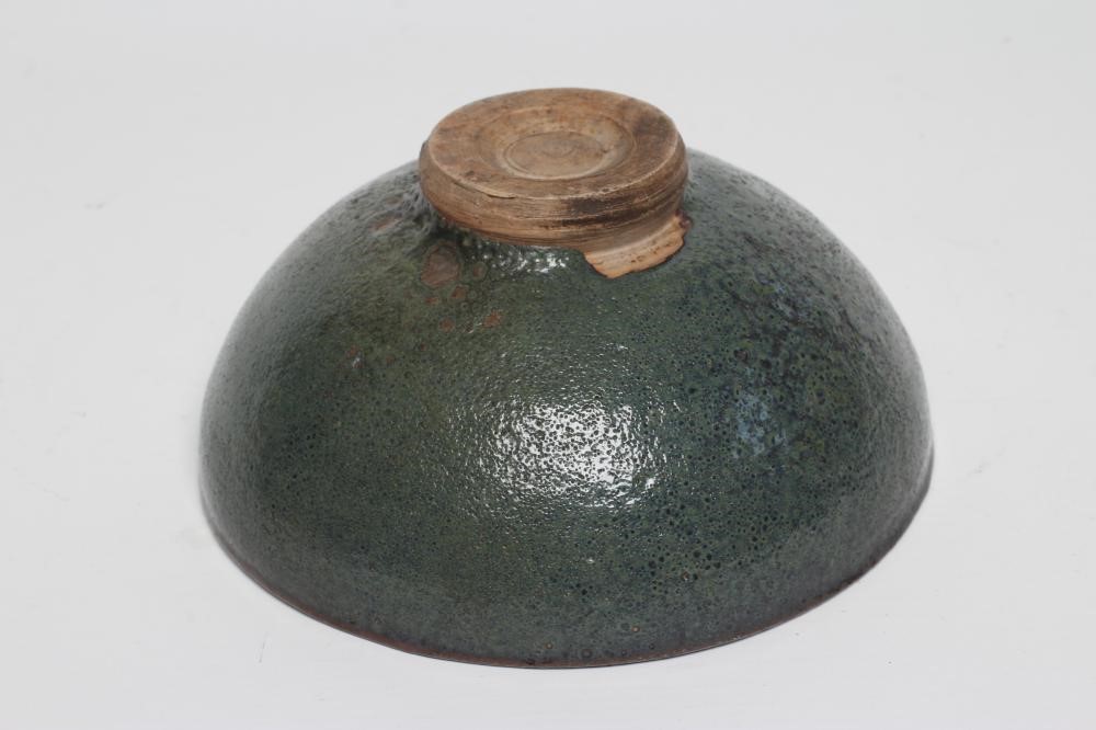 A CHINESE STONEWARE BOWL of plain circular form in a green "Jun" glaze Image
