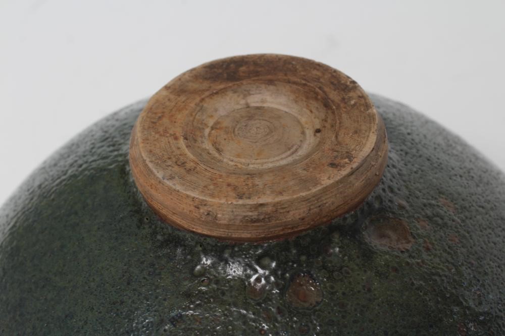 A CHINESE STONEWARE BOWL of plain circular form in a green "Jun" glaze Image