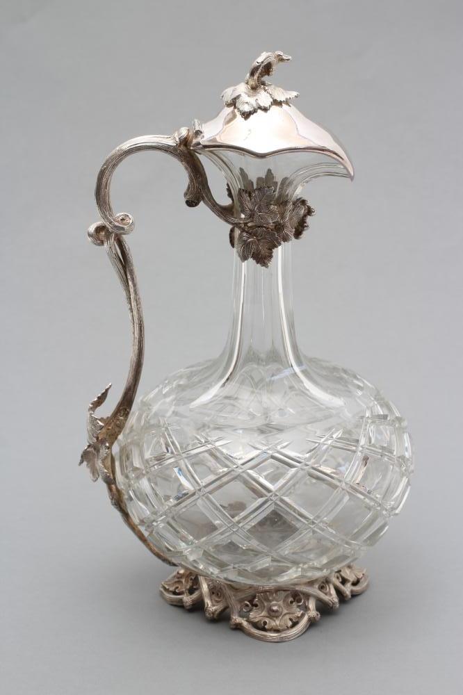 A HEAVY GLASS SHAFT AND GLOBE WINE EWER with panelled neck Image