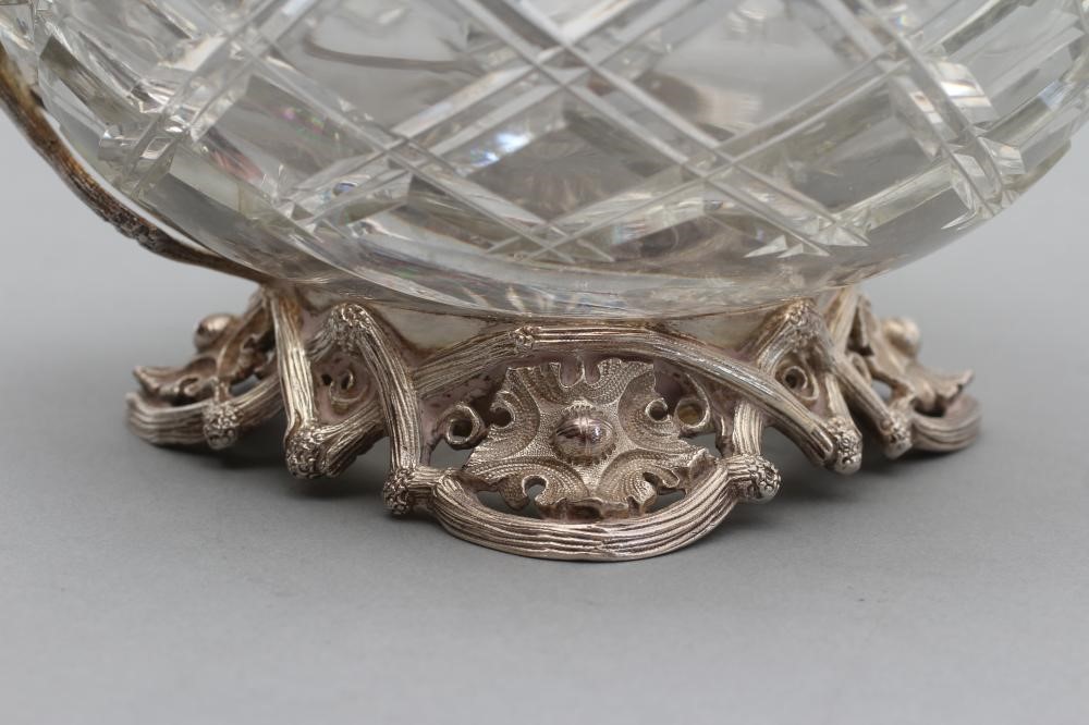 A HEAVY GLASS SHAFT AND GLOBE WINE EWER with panelled neck Image