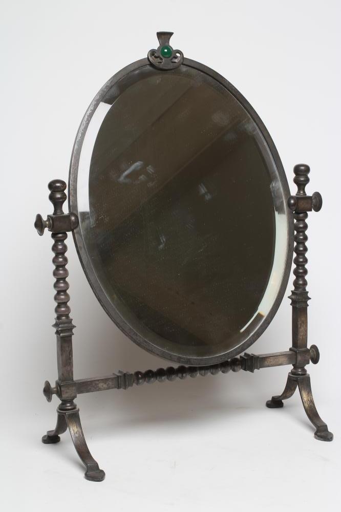 AN ARTS AND CRAFTS SILVERED STEEL FRAMED TOILET MIRROR Image