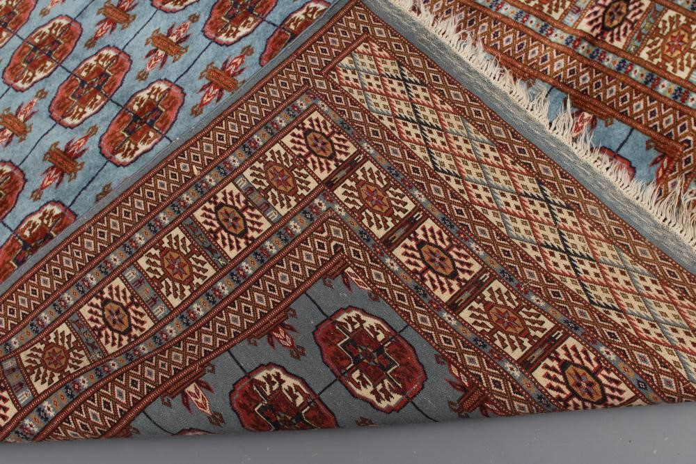 A BOKHARA DESIGN RUG Image