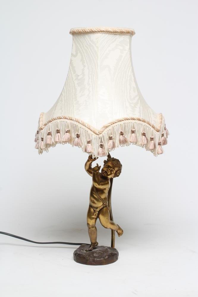 A GILT METAL TABLE LAMP Image