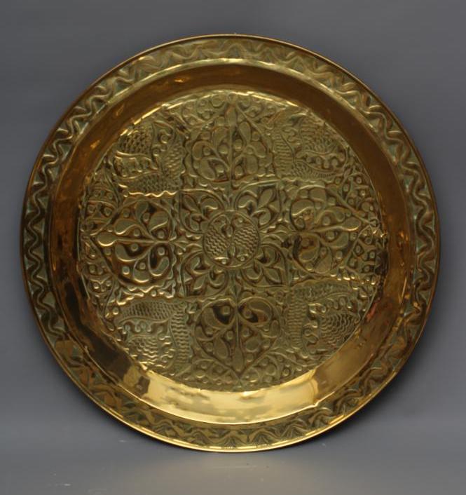 A LARGE ARTS AND CRAFTS BRASS CIRCULAR PLAQUE Image