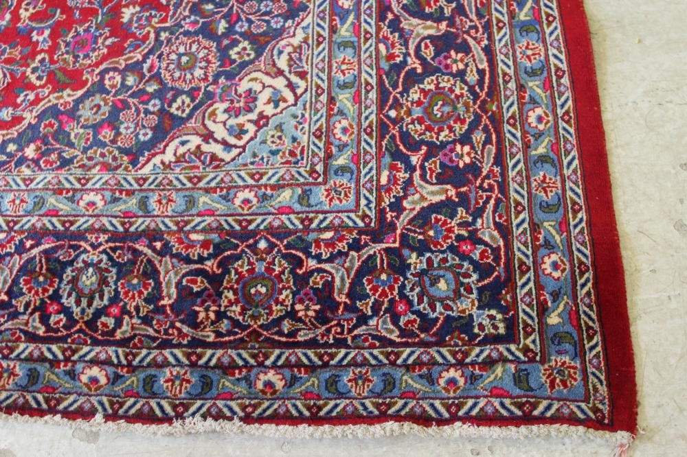 A PERSIAN STYLE WOOL CARPET Image