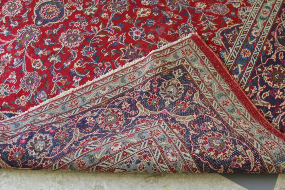 A PERSIAN STYLE WOOL CARPET Image