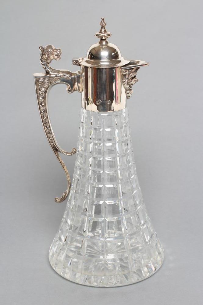 A SILVER MOUNTED CLARET JUG Image