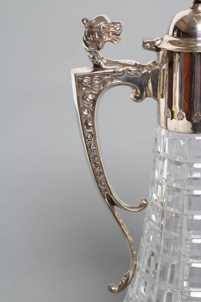 A SILVER MOUNTED CLARET JUG Image